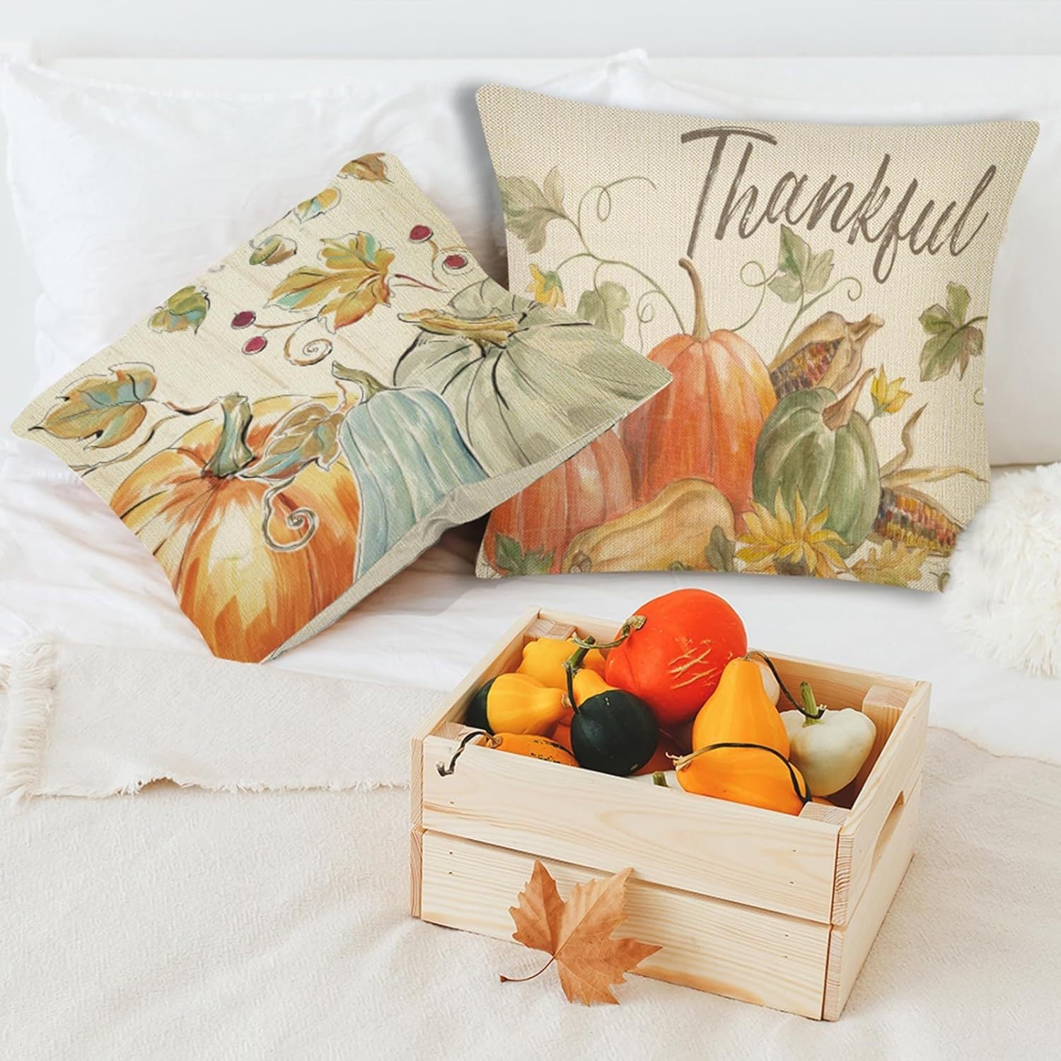 4PCS Thanksgiving Pillow Covers featuring pumpkin and thankful designs with a wooden crate of decorative gourds.